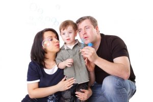 happy-family-having-fun-father-mother-child-blow-bubbles-series_221436-217